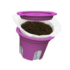 a purple cup filled with dirt on top of a white table