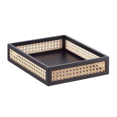 a black and gold tray with an intricate design on the bottom, in front of a white background