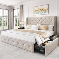 a bedroom with a large bed and two drawers