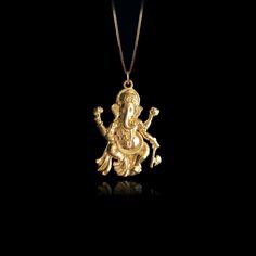 Elevate your faith with our 14k Gold Ganesh Pendant, symbolizing wisdom and prosperity in Hinduism. This solid gold Ganesh necklace captures the essence of the Elephant God. The 14 karat gold Ganesh pendant is more than just jewelry; it's a fine religious symbol that resonates with those seeking a connection to Hindu heritage. Explore our collection of Ganesh-themed jewelry, including elegant gold medallions, also available in 14k yellow gold. PENDANT INFORMATIONThis pendant is made of real, solid gold.• Made in USA• Material: 14k or 18k solid gold• Finish: polished• Height: 1.25" (32 mm) | *includes the small circle, bail dimensions not included• Width: 0.9" (22,5 mm)• Pendant weight: approx. 6 grams (14k)• Bail: fits up to 4 mm chains• Solid back, not hollow• A certificate of authenticit Spiritual 22k Gold Jewelry For Celebration, Gold Temple Necklace Pendant In Sterling Silver, Gold Temple Necklace In Sterling Silver As A Gift, Gold Sterling Silver Temple Necklace Gift, Yellow Gold Plated Jewelry For Rituals, Yellow Gold Locket Jewelry For Festivals, Spiritual Yellow Gold Festive Jewelry, Elegant Yellow Gold Necklace For Puja, Spiritual 14k Gold Jewelry For Celebrations