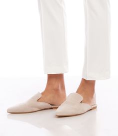 From daytime strolls to evening soirees, these handcrafted mules seamlessly transition from one event to the next. The suede material not only exudes a luxurious aesthetic but also conforms to your foot, providing a personalized and comfortable fit. 100% Leather Imported Flat Sole Runs small; we recommend sizing up Avoid water - rub with dry cloth | Karen Kane Suede Leather Mules in Cream, Size 37, Plain Formal Suede Slip-ons With Almond Toe, Fall Evening Slip-on Mules, Elegant Slip-on Slippers With Round Toe, Formal Beige Slip-ons For Spring, Chic Beige Almond Toe Slip-ons, Elegant Almond Toe Slip-ons For Fall, Chic Closed Toe Slip-ons With Branded Insole, Evening Mules With Leather Sole And Flat Heel, Elegant Slip-on Slippers With Leather Sole