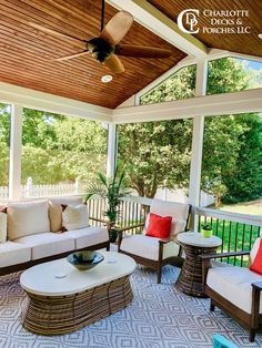 a covered porch with furniture and ceiling fan