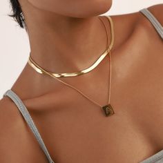 Introducing the Viper Snake Chain: an audacious golden snake chain, primed to layer with any of our dainty necklaces. It's not just a chain—it's your bold ally in creating a defiant ensemble. Stainless steel 18k gold plated Chain Water resistant