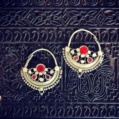 These are mid-sized silver Waziri earrings that have a wearing size of approx 1.2mm or 16g & weigh 16.1 grams. They are unusual as they are set with red glass stones. A beautiful matched pair. Silver Jeweled Earrings For Festive Occasions, Silver Jeweled Chandbali Jewelry, Ornate Red Drop Earrings, Silver Jeweled Chandbali Earrings, Silver Chandbali Earrings With Jewels, Red Jeweled Chandbali Earrings, Silver Jeweled Earrings For Festivals, Traditional Silver Hoop Earrings For Gift, Traditional Silver Hoop Earrings As Gift