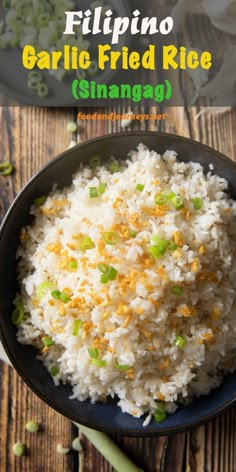 rice in a black bowl with green onions on the side and text overlay that reads philippines garlic fried rice