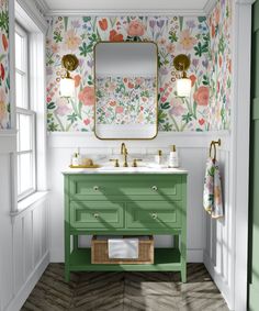 a bathroom with floral wallpaper and green vanity