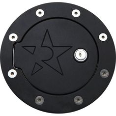 an image of a black metal object with stars on it's center piece and two holes in the middle