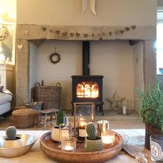 a living room filled with furniture and a fire place