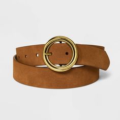 Reversible Wide Suede Round Center Buckle Belt from Universal Thread™. Designed with a gold-tone round buckle and a wide width profile, the reversible suede belt is tan brown on one side and off-white on the other to give you two ways to wear. The adjustable strap with multiple holes give a secure fit to all your outfits, you can pair it with a range of ensembles to dress up your style. Universal Thread™: Found exclusively at Target. Women’s Belts, Target Jeans, Branded Belts, Suede Belt, Reversible Belt, Loose Jeans, Belt Size, Leather Fabric, Tan Brown