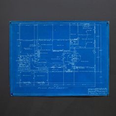 a blueprint on the wall shows plans for a house