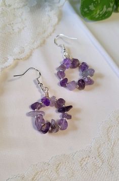 the earrings are made with amethyst beads