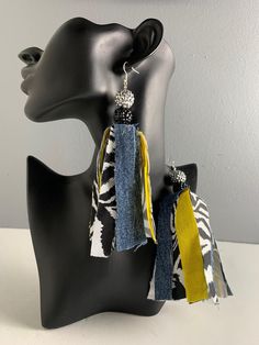 Dangle earrings made from zebra print fabric, denim, yellow fabric, and rhinestone beads. Fabric earrings, cloth earrings, tassel earrings, denim earrings. Fabric Earrings Handmade, Cloth Earrings, Diy Earrings Materials, Earrings Fabric, Beads Fabric, Denim Earrings, Earrings Tassel, Diy Denim, Denim Jewelry