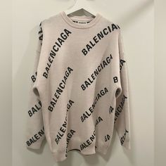 Balenciaga Light Beige And Black Round Neck Allover Logo Pullover Sweater In Size Small. Brand New, Never Worn. No Tags. Designer Crew Neck Sweater For Spring, Designer Long Sleeve Winter Sweatshirt, Designer Beige Long Sleeve Tops, Designer Long Sleeve Beige Tops, Designer Long Sleeve Winter Sweater, Designer White Sweater, Designer White Long Sleeve Sweater, Designer Letter Print Tops For Winter, Designer Oversized Tops For Winter