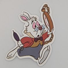 a sticker with an image of a rabbit holding a magnifying glass in it's hand