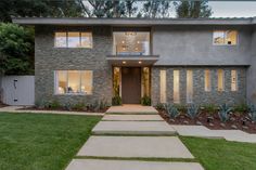 Beverly Hills ranch home stacked slate stone wall exterior with ribbon windows & California landscape design. Stone Wall Exterior, Slate Stone Wall, California Landscape Design, Modern Modular Homes, Modern Minimalist House, Modern Prefab Homes