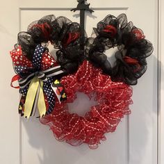 two wreaths are hanging on the front door