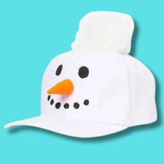 a white hat with a snowman's face on it, against a blue background