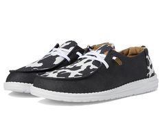 Hey Dude Wendy Animal - Women's Shoes : Black/Cow : Walk in style and comfort as you step out of the house wearing the Hey Dude Wendy Animal shoes. Textile upper and lining. Man-made insole. Slip-on style with lace closure. Round toe box. Intricate cow-skin inspired print allover. Man-made outsole. Imported. Measurements: Weight: 5 oz Product measurements were taken using size 10, width M. Please note that measurements may vary by size. Cow Hey Dudes, Cow Print Hey Dudes, Dudes Shoes, Country Fits, Animal Shoes, Hey Dudes, Black Cow, Cow Skin, Walking On Clouds