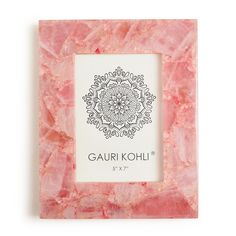 a pink marble photo frame with the words gauri kohi on it