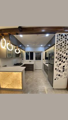 a kitchen with an island counter and lights