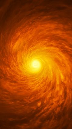 an orange and yellow spiral shaped object in the sky