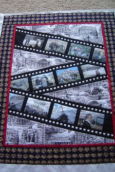 a black and white quilt with pictures on it