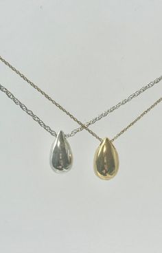 This beautiful mini teardrop pendant is a unique way to hold a loved one close. This pendant can hold a small amount of cremains, lock of hair, or dirt from the sacred burial grounds. This piece comes on an 18" matching chain.  size 1/2 inch engraving is ♥we are able to engraving up to 3 letters 2 sides ♥Engraving can be done in block or script font and in uppercase or lowercase as well as numbers GOOD TO KNOW: ♥ Available in 14k plated gold or a Sterling Silver ♥THIS PENDANT CAN BE ENGRAVED-SEE Classic Teardrop Drop Necklace For Anniversary, Classic Teardrop Necklace For Anniversary, Dainty Teardrop Pendant Drop Necklace For Everyday, Minimalist Teardrop Pendant Drop Gift, Dainty Teardrop Drop Necklace For Everyday, Minimalist Teardrop Pendant As A Gift, Dainty Teardrop Necklace For Everyday, Minimalist Teardrop Pendant For Gift, Classic Silver Teardrop Pendant