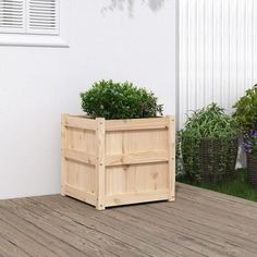 two wooden planters sitting on top of a wooden deck