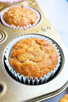 some muffins are sitting in the cupcake tin