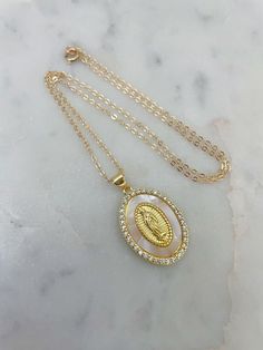 Beautiful Virgin Mary pendant necklace. Measuring approx 20X30mm. Choose length. Great religious gift for all events including confirmation, baptism, first communion, marriage and weddings and for all religious. Giftbox included. 14k gold filled chain with 14k gold filled jumprings/clasp. First Communion Necklace, White Necklace For First Communion And Mother's Day, Virgin Mary Necklace Gold, Gold Coin Jewelry, Van Cleef And Arpels Jewelry, Catholic Necklace, Virgin Mary Necklace, Necklace Outfit, Mexican Jewelry