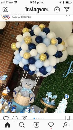 an instagram with balloons, teddy bears and other items on it's display