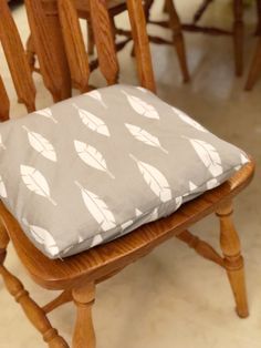 a wooden chair with a cushion on it