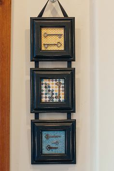 three framed pictures hanging on the wall