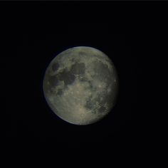 the full moon is seen in the dark sky