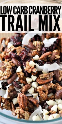 a glass bowl filled with granola and nuts