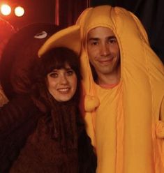 a man and woman dressed up in costumes