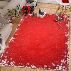 a red area rug with white snowflakes on it in a living room setting