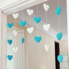 blue and white hearts hanging from the ceiling