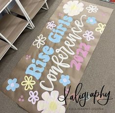 there is a sign on the floor that says carefree and has flowers painted all over it