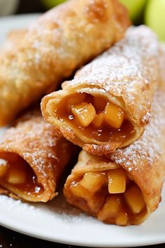 apple turnovers on a plate with powdered sugar