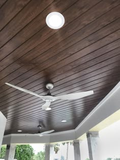 a ceiling fan on the outside of a house