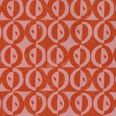 an orange and pink pattern with circles on it's side, in the middle