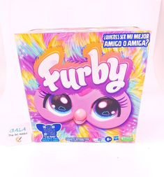 an unopened box of furby cereal sitting on top of a white table