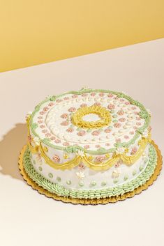 there is a cake that has been decorated with flowers on the top and bottom layer