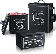 three different types of black containers with labels on them and one is filled with candy