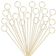 a bunch of gold colored metal circles on a white background