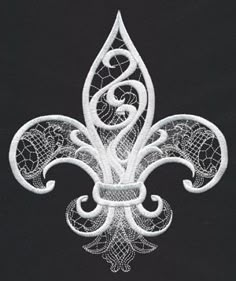 a white embroidered fleur de lis on a black background with an intricate design