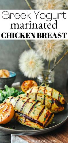 greek yogurt marinated chicken breast on a plate with salad and flowers in the background