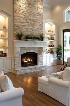 a living room filled with furniture and a fire place in the middle of a room