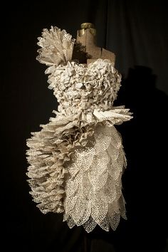 a dress made out of paper and lace